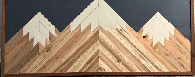Framed mountain design made from contrasting pieces of wood
